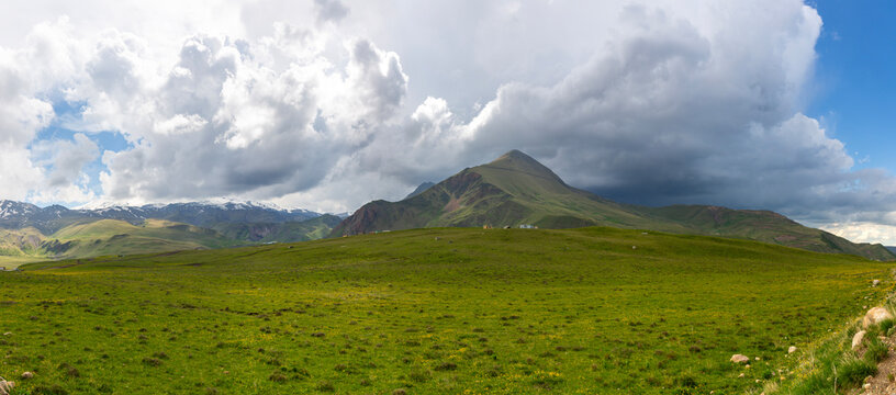 Landscape of Great Caucasus range and green mountain slopes at summer travel