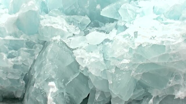 Witness Arctic Ocean's massive ice formations. Jagged blue-green shards drift and clash, a testament to nature's extreme power during challenging travel.