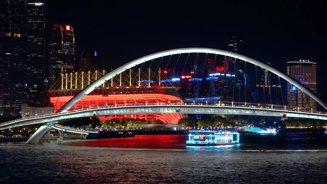 Tianjin Hai River illuminated bridge and skyline at night