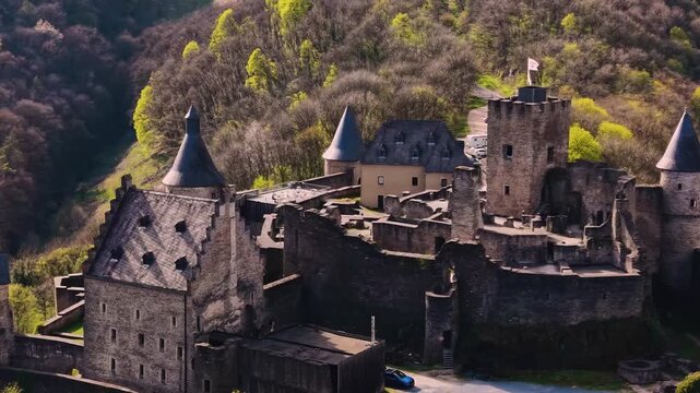 A panoramic Aerial view of the city and castle  Bourscheid in Luxembourg, on a sunny spring noon