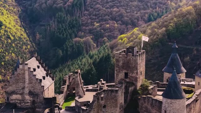 A panoramic Aerial view of the city and castle  Bourscheid in Luxembourg, on a sunny spring noon