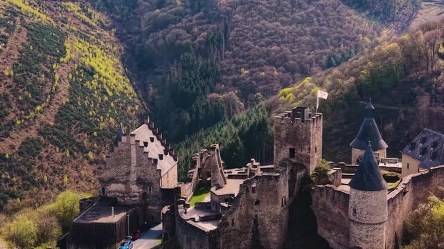 A panoramic Aerial view of the city and castle  Bourscheid in Luxembourg, on a sunny spring noon