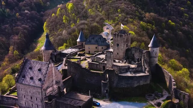 A panoramic Aerial view of the city and castle  Bourscheid in Luxembourg, on a sunny spring noon