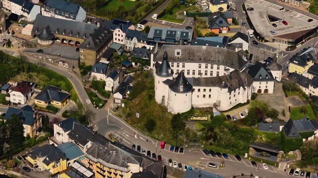 A panoramic Aerial view of the city and castle Clervaux in Luxembourg, on a sunny spring noon