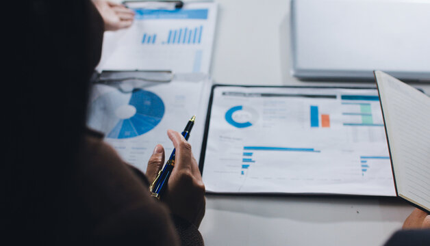 Accountants processing financial documents and taxes, managing corporate finance in a modern office. Audit and taxes in business