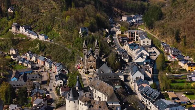 A panoramic Aerial view of the city and castle Clervaux in Luxembourg, on a sunny spring noon