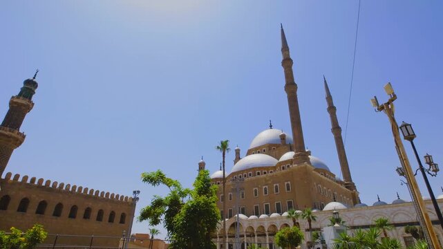 Horizontal camera movement revealing the grand mosque with domes and minarets in Cairo, Egypt, captured in cinematic slow motion 4K during travel.