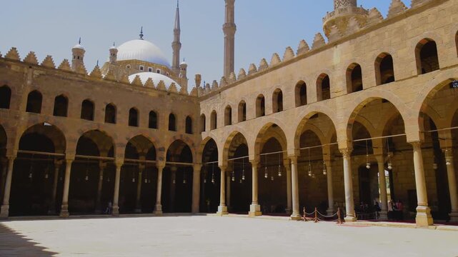 Slow upward camera movement revealing the grand mosque courtyard and domes in Cairo, Egypt, captured in cinematic 4K during travel.