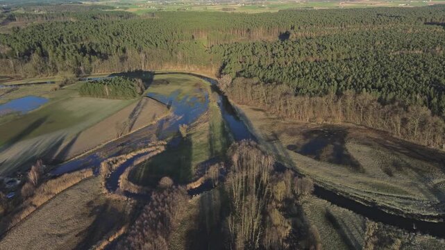 Aerial Flyover of River and Surrounding Nature &ndash; 4K ProRes