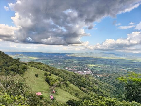 view from the mountain Aerial panoramic view of Ansermanuevo town and Cauca Valley landscape in Colombia on a sunny day` 