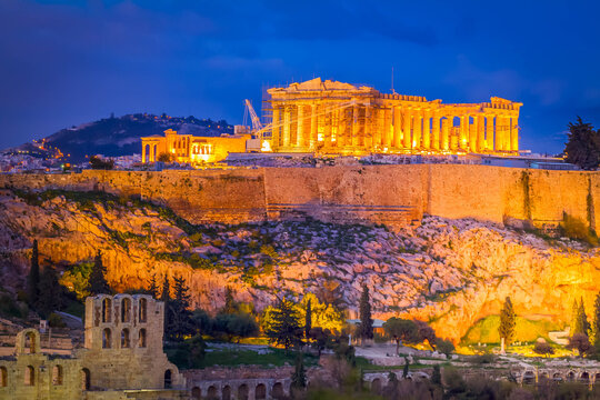 Famous skyline of Athens with Acropolis hill and Pathenon illuminated at night, Athens Greecer