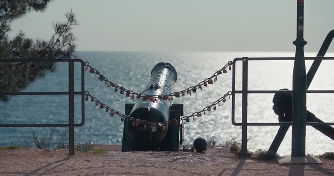 Historic cannon overlooking the Adriatic Sea in Rovinj, Croatia during the afternoon.