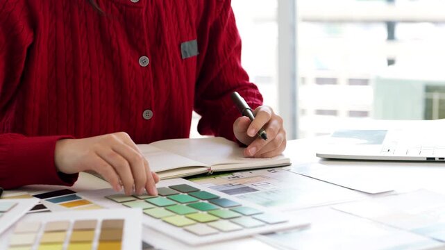 Architect or interior designers are finalizing the design of interiors by selecting materials and colors for finishing to design rooms to present to clients.