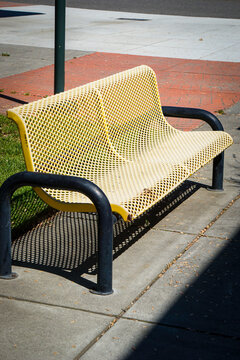 Old metal bench in outdoor courtyard