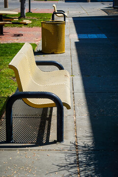 Old metal bench in outdoor courtyard