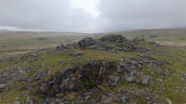Aerial views of surroundings at Foggintor Quarry, one of the largest abandoned quarries on the moor of the Dartmoor National Park. Drone POV of United Kingdom Landscapes in Devon.