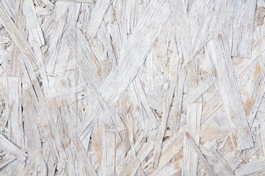 Wooden chipboard background. Close up of chipboard texture.