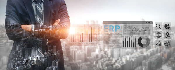 A confident businessman stands with arms crossed against a backdrop of a city skyline, showcasing digital analytics and enterprise resource planning concepts. Ledger © InfiniteFlow