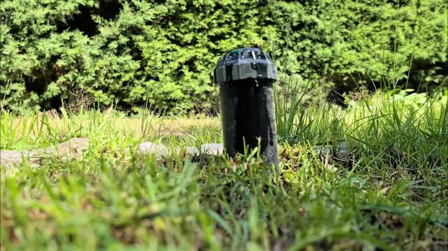 Water is wasted from the automatic sprinkler because it is not properly closed.