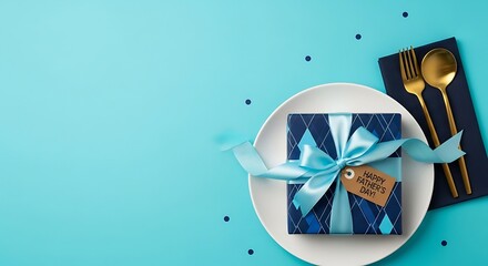 Festive blue gift box with satin ribbon placed on white plate celebrating fathers day holiday