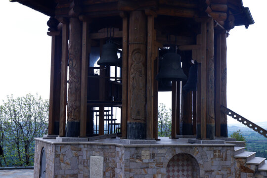 Carved Wooden Bell Tower and Bronze Bells of Orthodox Monastery