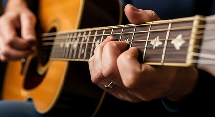 Obraz premium Close Up Hands Playing Acoustic Guitar in Warm Indoor Light
