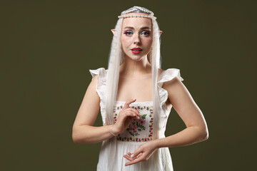 Naklejka premium Beautiful elf girl on dark olive background