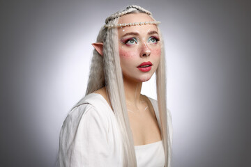 Naklejka premium Beautiful elf girl on grey gradient background