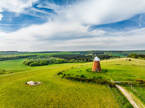 Fields and Farms over Halnaker Hill and the Windmill Trail from a drone, Boxgrove Village, West Sussex, England