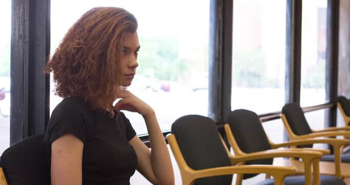 Female sitting in waiting room 4k
