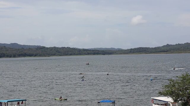 Summer Recreation with Water Sports on Calm Lake Landscape