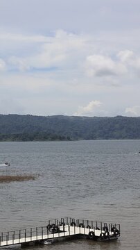 Summer Recreation with Water Sports on Calm Lake Landscape