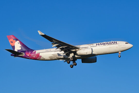 Hawaiian Airlines Airbus A330-200 (N386HA) passenger plane landing approach at Narita Airport.