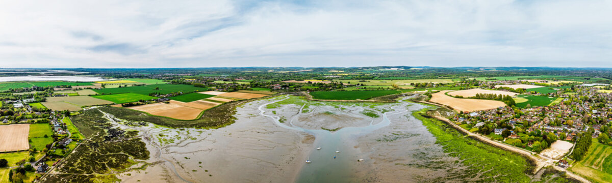 Bosham Quay from a drone at low tide, Chichester Harbour National Landscape, Chichester, West Sussex, England