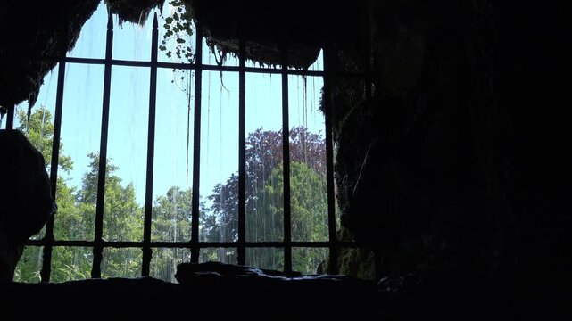 Prison bars with water flowing outside 4k
