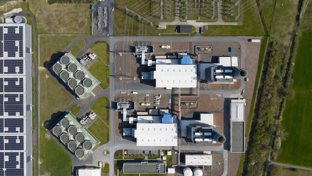 Aerial view of the Trianel Gaskraftwerk Hamm gas power plant with cooling towers, solar panels, and electrical infrastructure Hamm, Nordrhein-Westfalen, Germany.