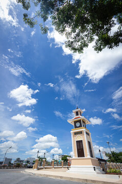 The Three Cultures Clock Tower landmark under a vibrant blue sky in Pattani, Thailand
