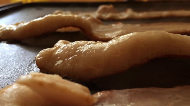 Sizzling bacon on griddle with sound
