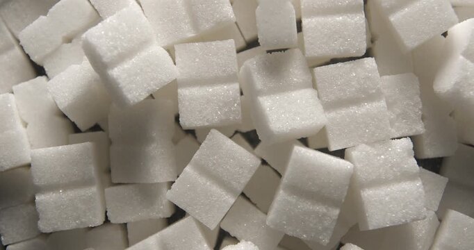 Sugar cubes close up studio shot over rotating