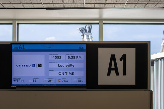 Houston, TX, USA - May 3, 2026: A LED screen that displays flight and weather information at the terminal gate A1 in George Bush International Airport in Houston, Texas.