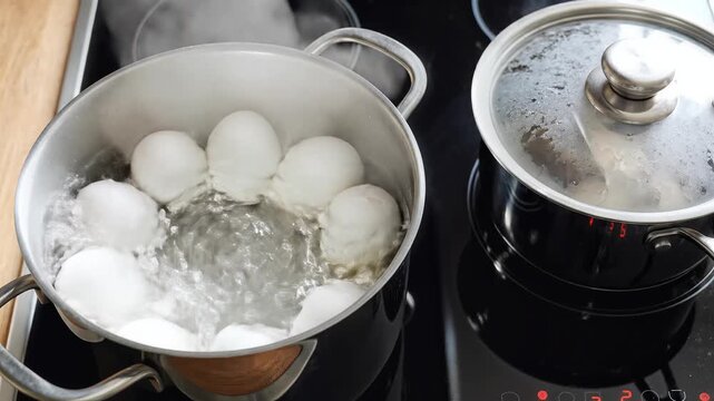 Boiling Eggs in a Pot on a Stove Top.