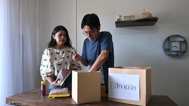 Young people preparing food and supplies for donation box