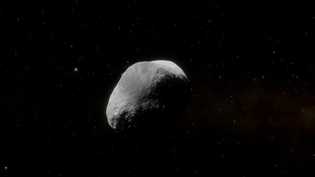 Animation of rotating asteroid 2598 Merlin drifting through deep space with stars in background. 