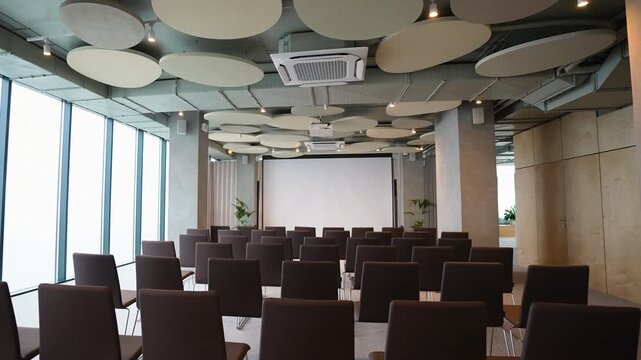 Empty modern conference room with projector screen