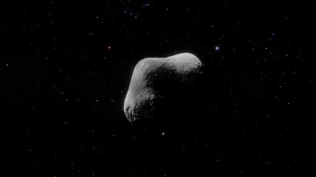 Animation of rotating asteroid 2598 Merlin drifting through deep space with stars in background. 