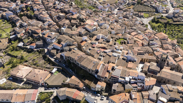 Aerial view of the historic stone buildings and terracotta rooftops of the village of Fermoselle nestled in a green landscape Fermoselle, Castile and Leon, Spain.