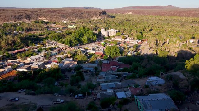 Discover aerial views showcasing Mission Church and the oasis town of San Ignacio, Baja California, Mexico with stunning landscapes.