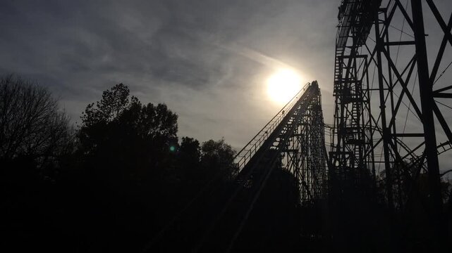 Rollercoaster silhouette going down hill
