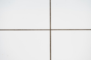Fototapeta premium white tiled wall pattern off centre background