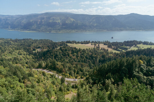 View down toward the Columbia River Gorge winding through the rich valley dotted with pine trees as seen from from the high vantage of the observation point on Cape Horn.